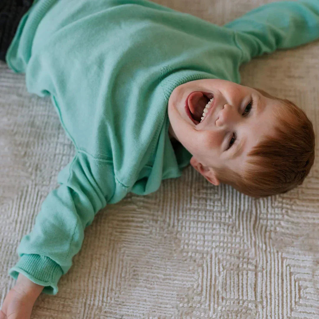 Kid wearing Cotton Cashmere Hoodie Sweater (Sea Glass Blue) by Firebird Kids