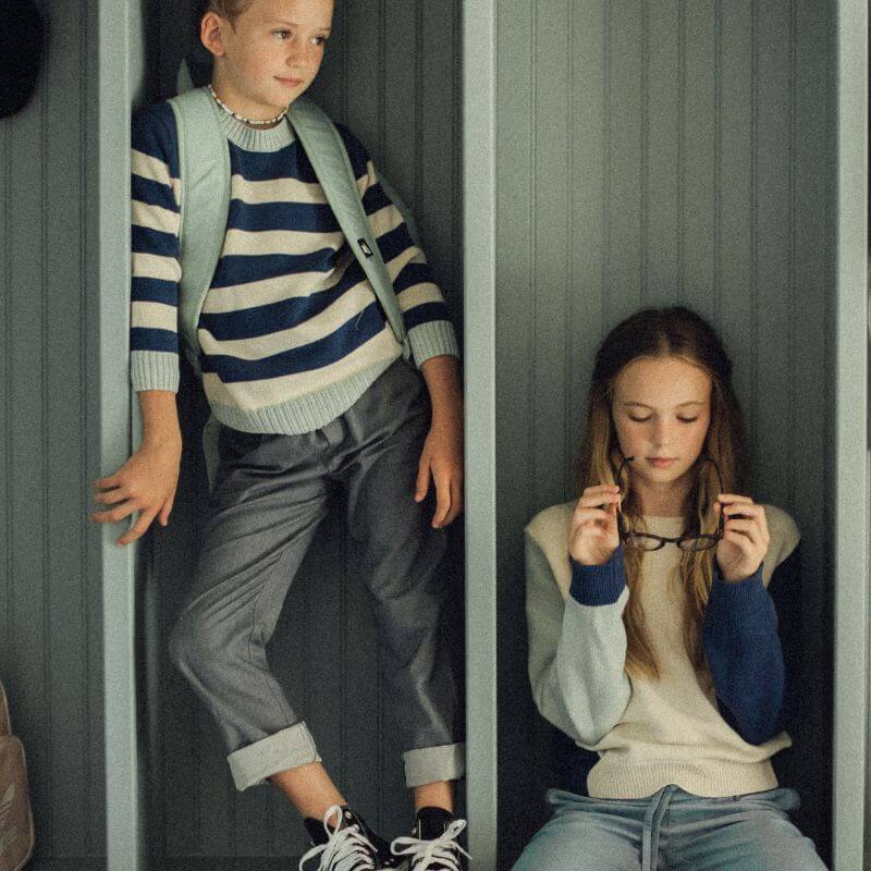 Two children dressed themselves using pieces from the Firebird Kids collection.