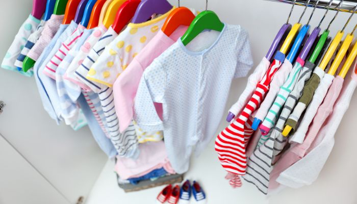 Kids clothes neatly organized by Firebird Kids
