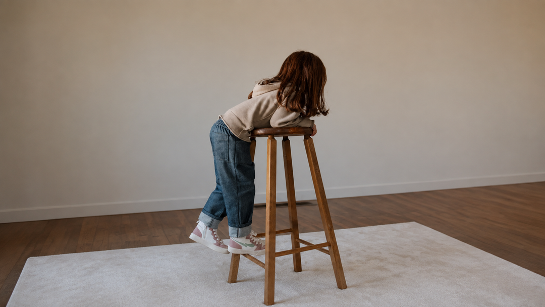 A child wearing The Studio Denim Pant by Firebird Kids