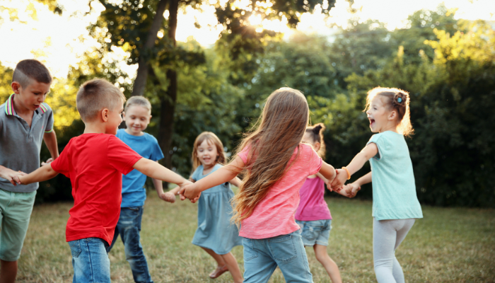 Kids wearing organic cotton kids clothing during active outdoor play