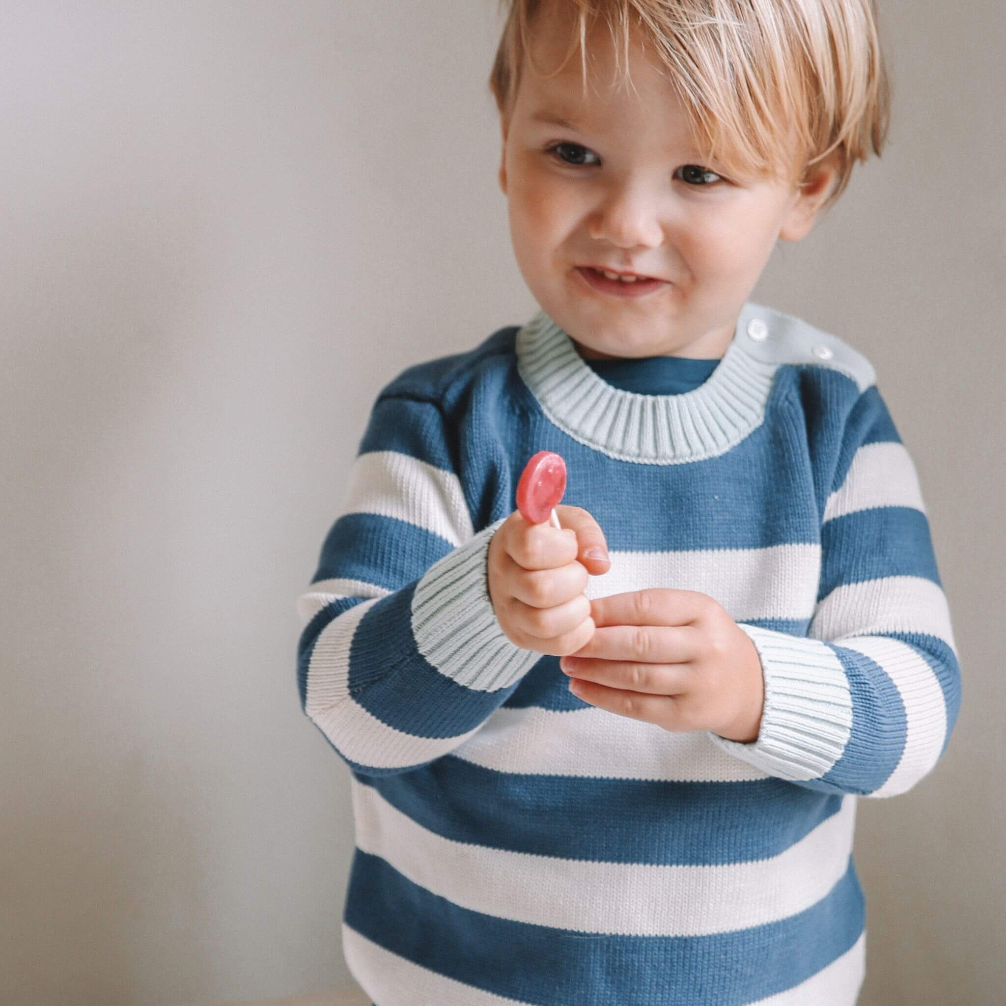 Firebird Kids Striped Crewneck Sweater, worn by a boy.