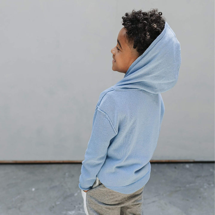 Back of a child wearing the Firebird Kids soft blue cotton-cashmere hoodie sweater