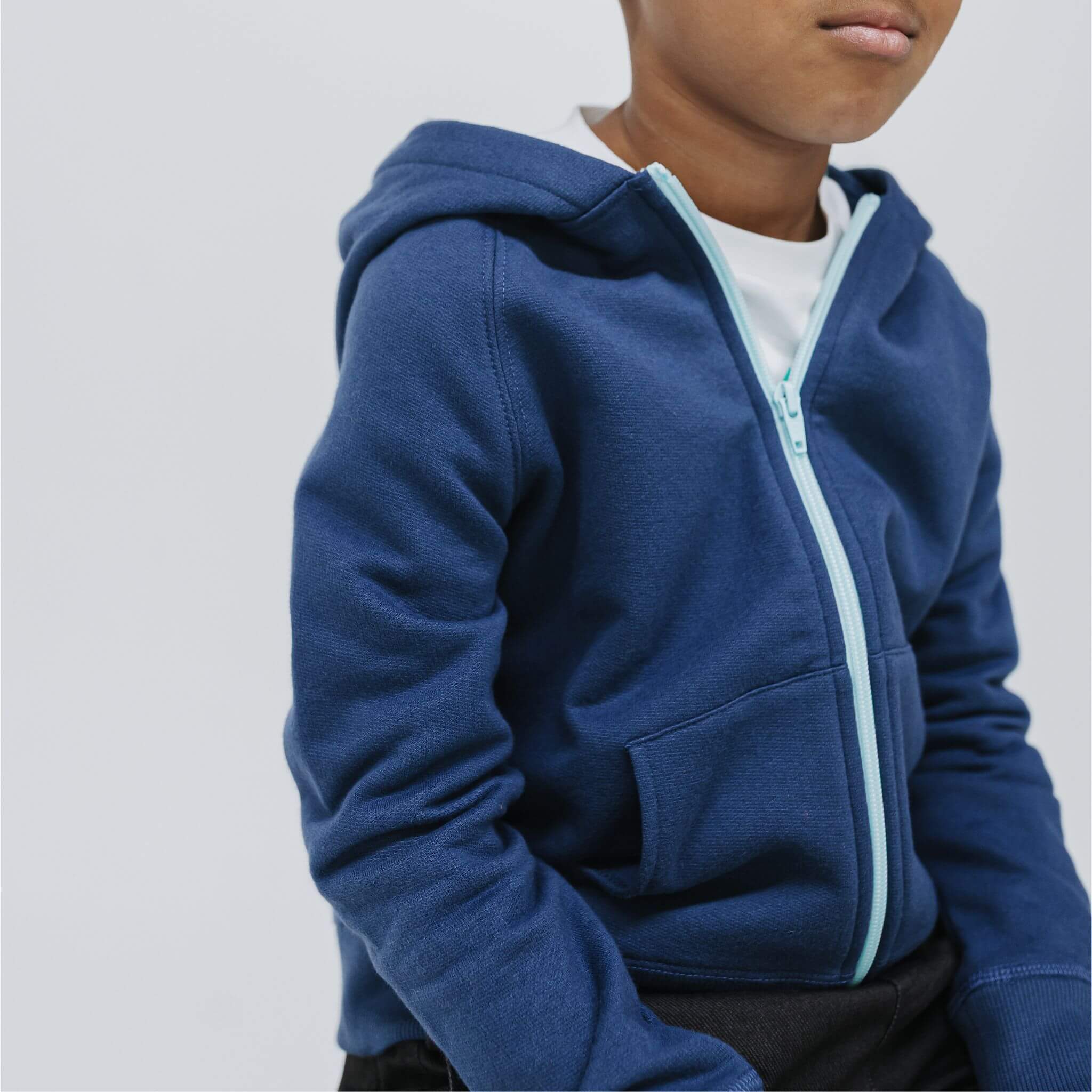 Close-up of the glacier-blue zipper on the navy kids fleece hoodie