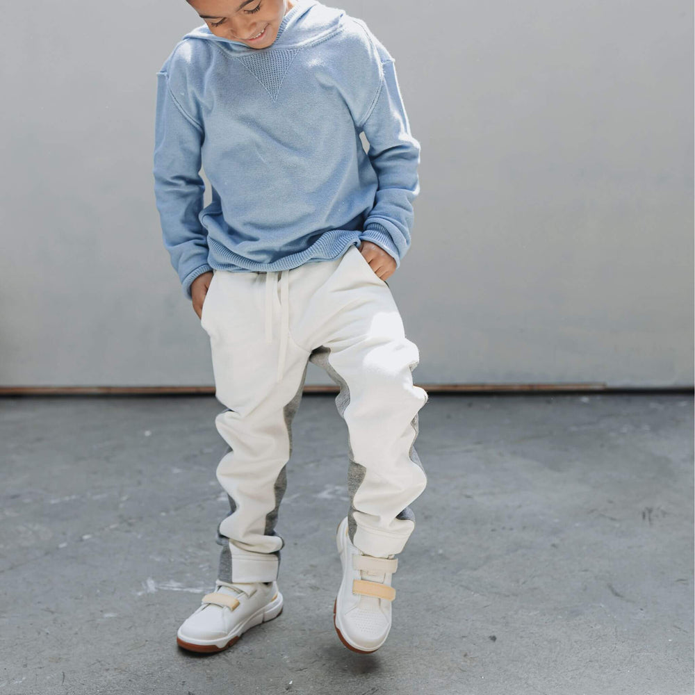 Boy wearing the Firebird Kids organic cotton fleece joggers