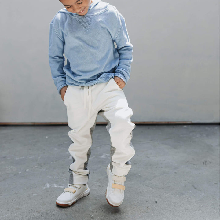 Boy wearing the Firebird Kids organic cotton fleece joggers