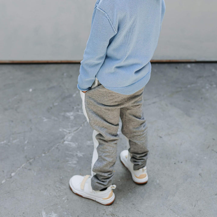 Boy wearing soft organic cotton joggers with a drawstring waist