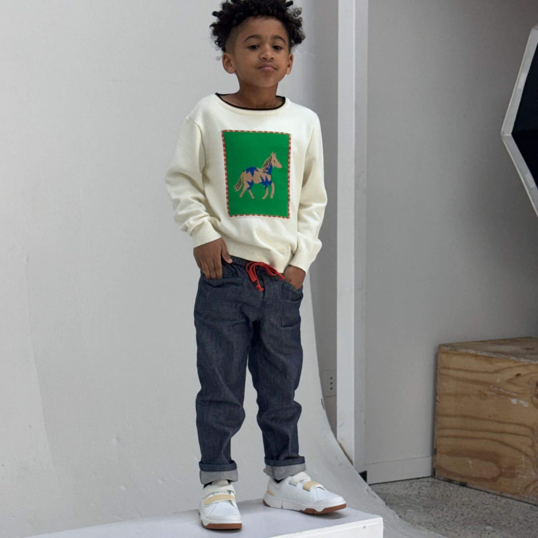 Boy wearing dark navy Firebird Studio Denim Pants in organic Japanese denim, front view