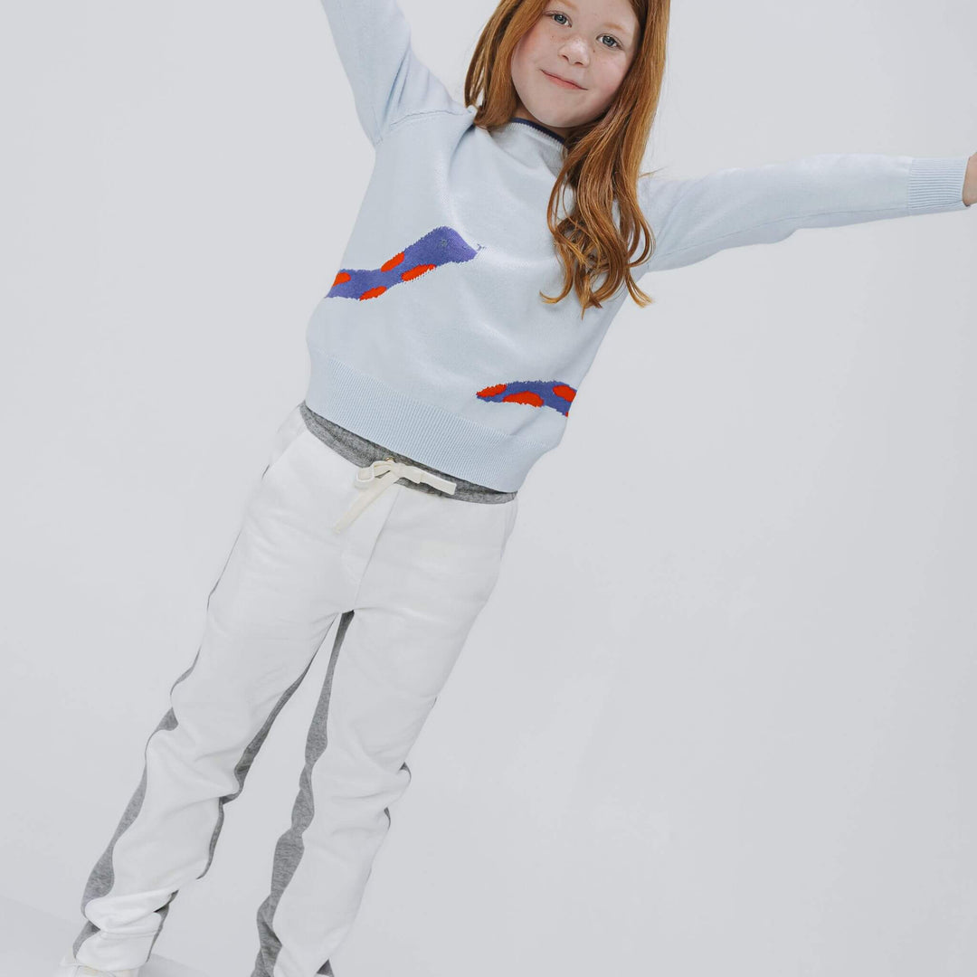 Girl wearing the Firebird Kids organic cotton fleece joggers