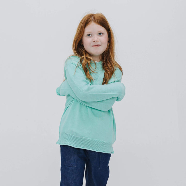 Girl in a lightweight Sea Glass Blue cashmere-blend hoodie