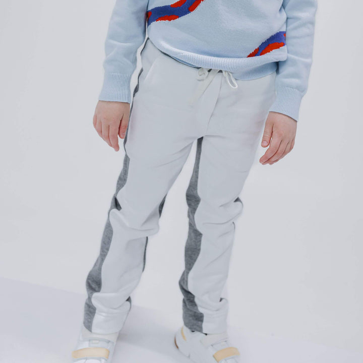 Girl wearing heather gray and ivory colorblock sweatpants