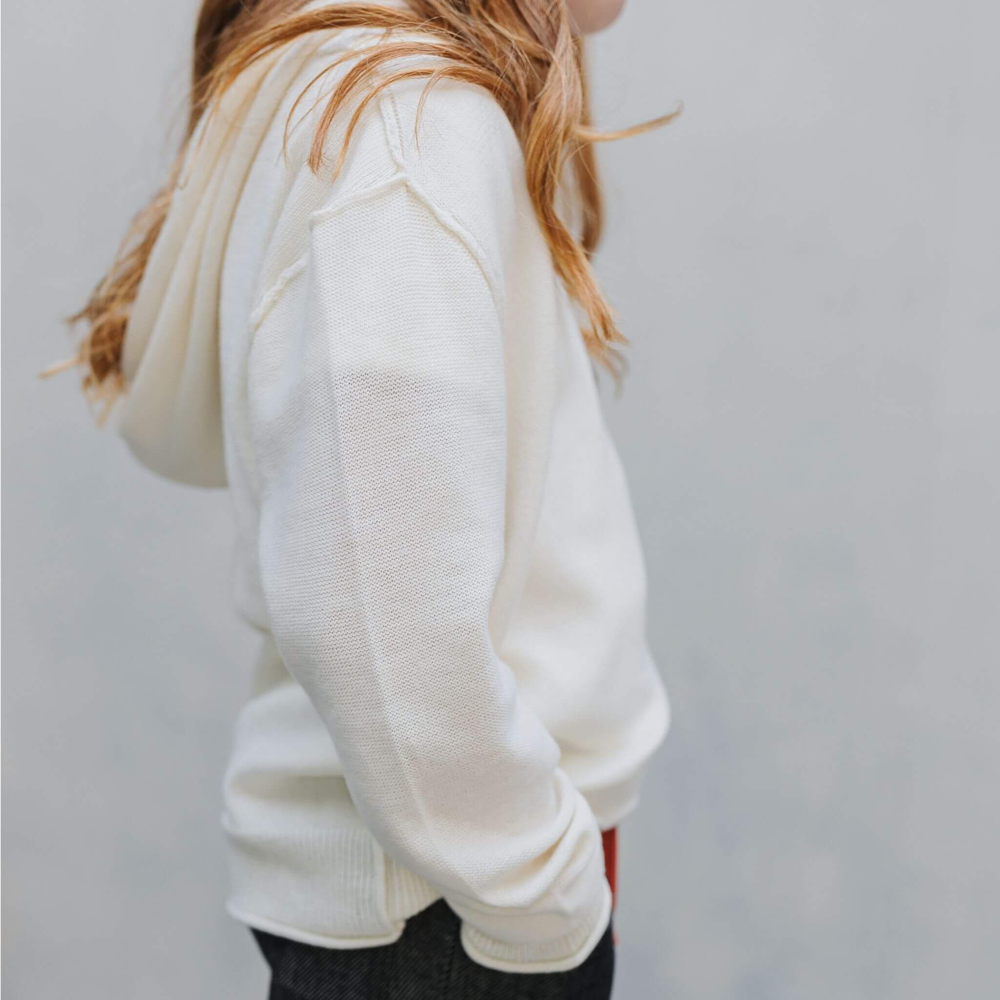 Front view of the Firebird Kids ivory cotton-cashmere hoodie sweater
