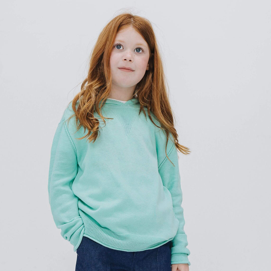 Girl in a lightweight Sea Glass Blue cashmere-blend hoodie