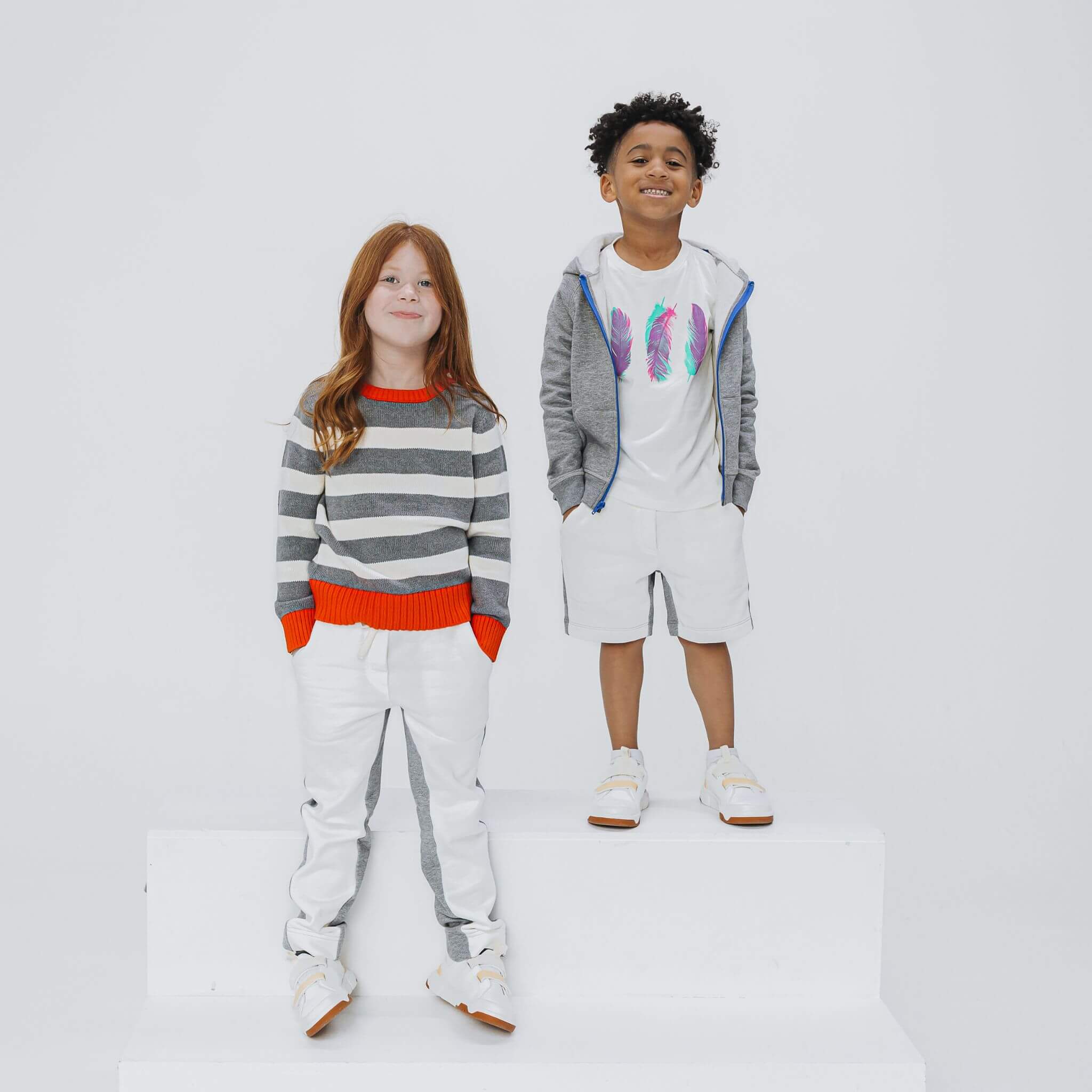 Girl wearing heather gray and ivory colorblock sweatpants