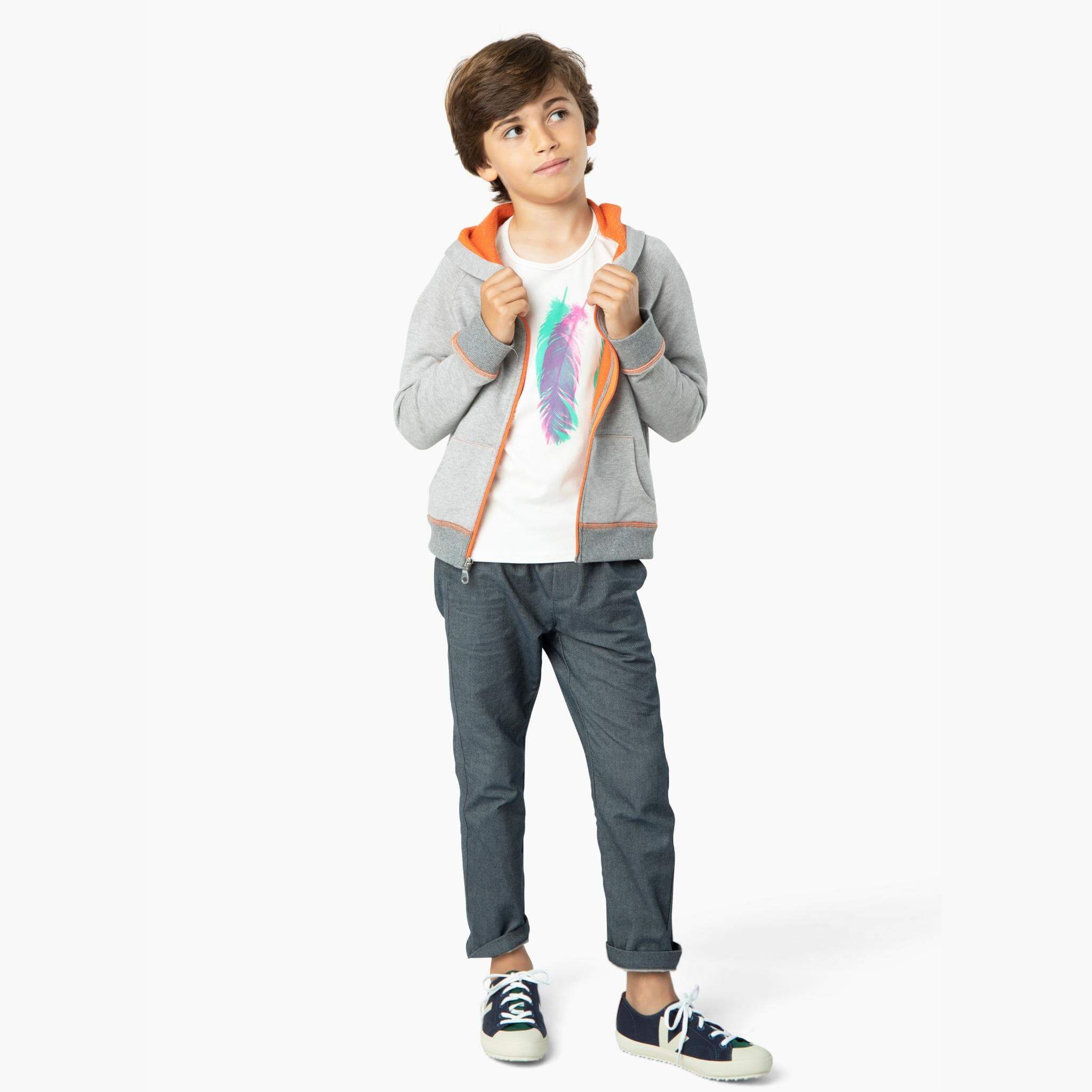 Boy wearing the perfect jean from our Kids Essentials collection: Soft Denim Pants in Dark Gray, made of 100% organic Japanese cotton for a comfortable, sustainable, and high-quality fashion choice.