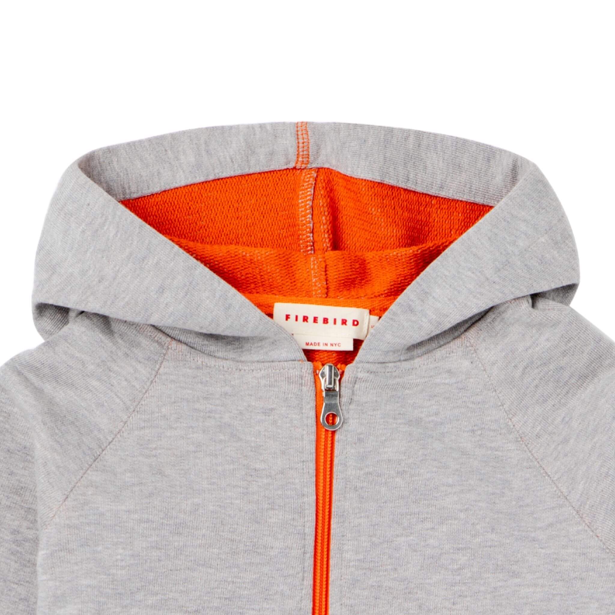 This must have summer hoodie for kids features a contrast orange zipper, lining and a hood. Unisex. Light weight and durable, it is made from organic Italian cotton in NYC.