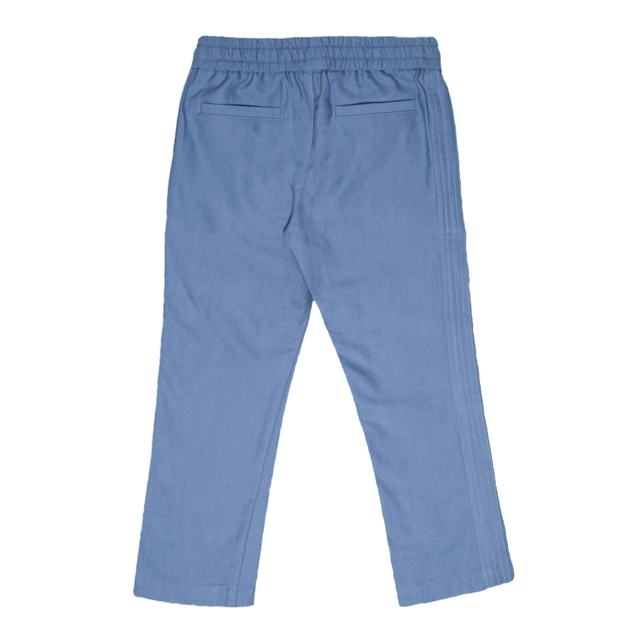 The perfect jean from our Kids Essentials collection. Soft Denim Pants in light blue (view from back), made of 100% organic Japanese cotton for sustainable and high-quality fashion.
