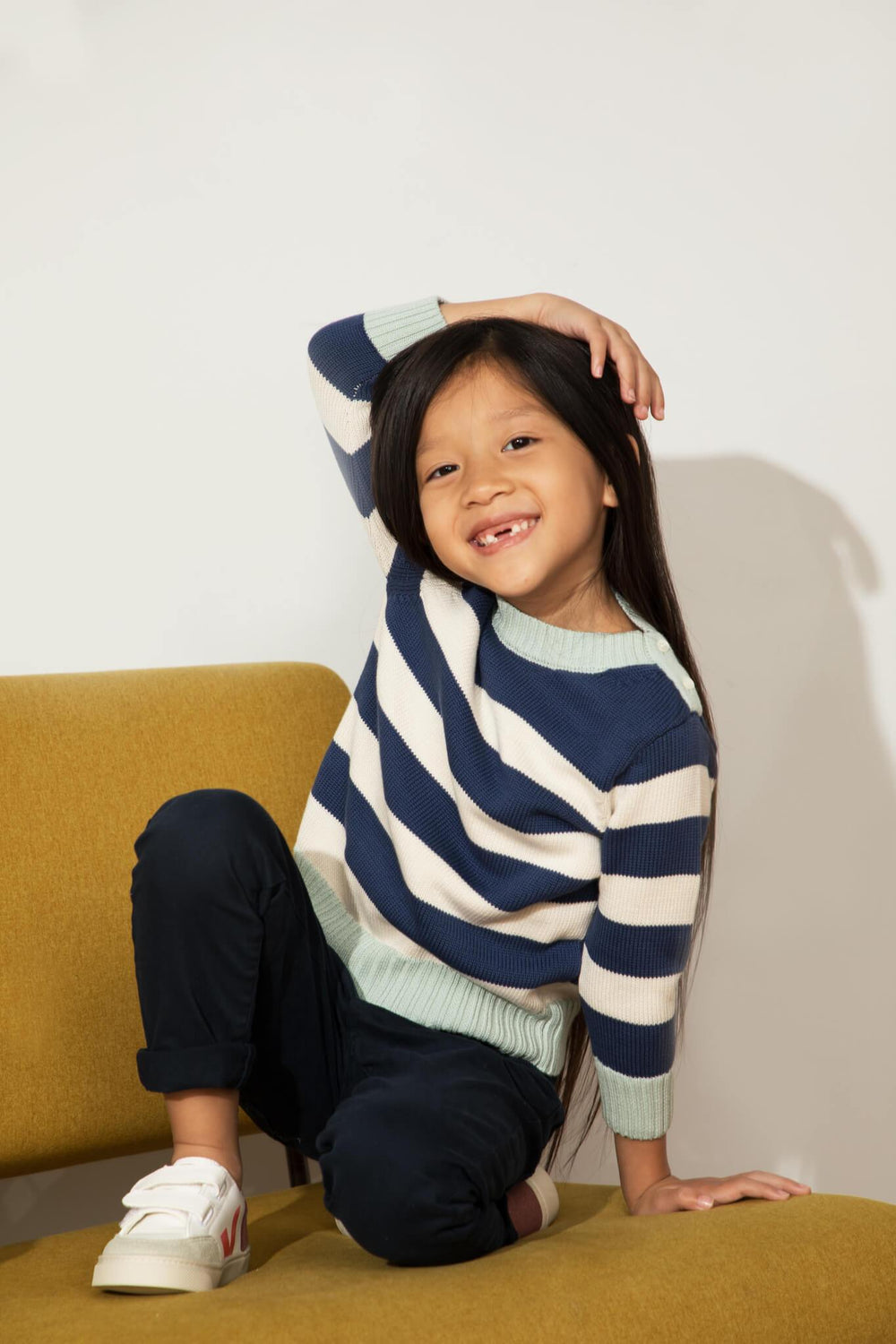 Firebird Kids Striped Crewneck Sweater, worn by a girl.